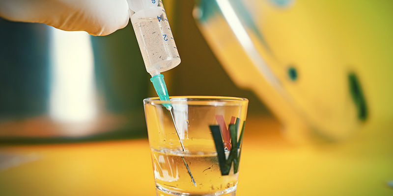 Magic Mushroom Spore Syringe: place the tip of your first syringe into the water and fill it up