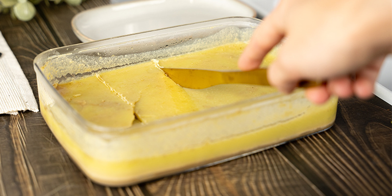 Dry the container and pat the butter dry with a paper towel.